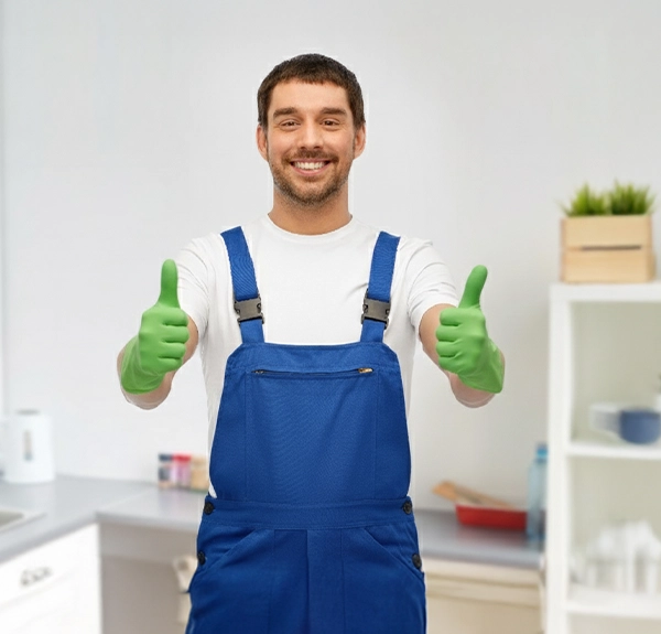 Happy Male Worker Or Cleaner In Gloves At Kitchen